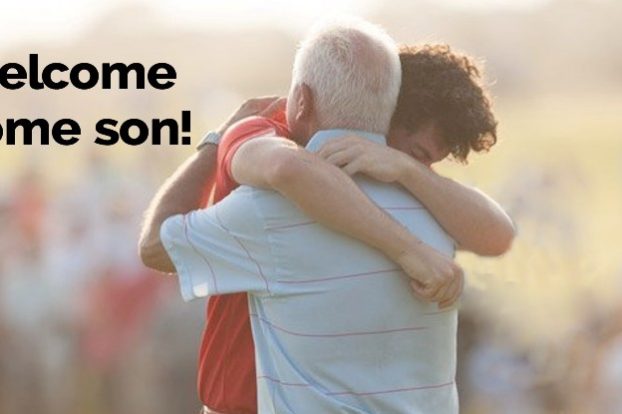 Father hugs son
