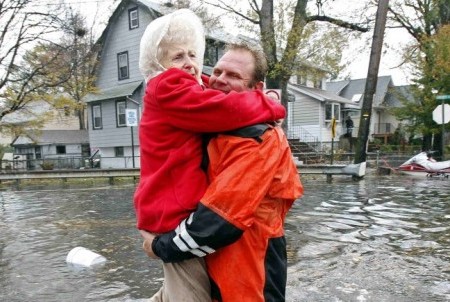 Man carrries elderly